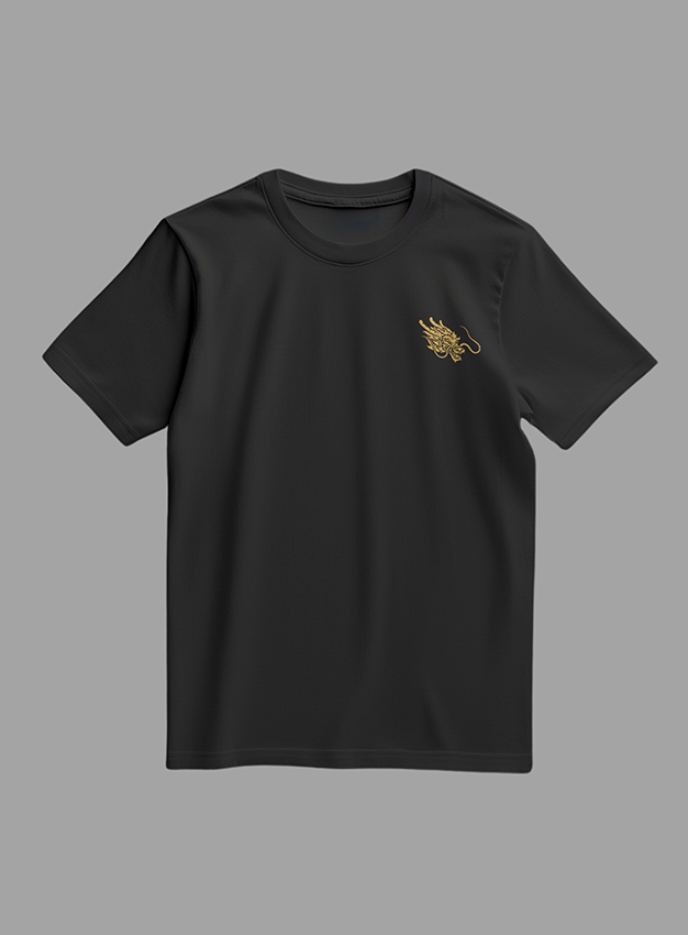 Black t-shirt with gold designs on a gray background